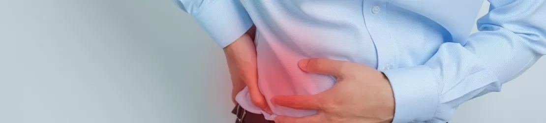 barbat care sufera de durere in zona abdominala